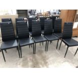 A SET OF ELEVEN MODERN BLACK LEATHER DINING CHAIRS