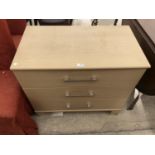 A MODERN THREE DRAWER CHEST OF DRAWERS