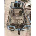 A MESH SIDED FOUR WHEEL TROLLEY WITH TYRE WHEELS
