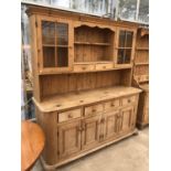 A LARGE VINTAGE PINE COUNTRY FARMHOUSE DRESSER UNIT WITH UPPER GLAZED DOORS AND LOWER DRAWERS AND