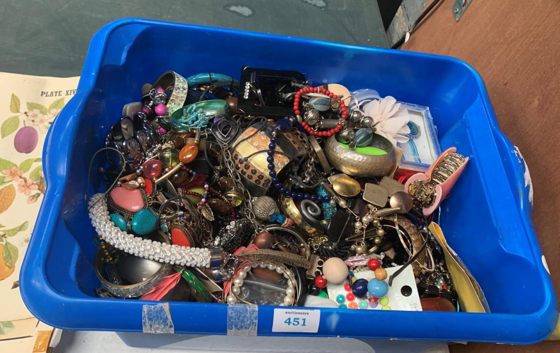 A LARGE TUB OF COSTUME JEWELLERY