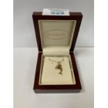 A BOXED 9CT GOLD DOLPHIN NECKLACE