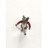 A SILVER MINIATURE FOX WITH RED JACKET
