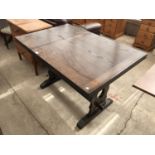 A JAYCEE OAK DRAW LEAF DINING TABLE