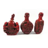 THREE ORIENTAL CORAL TYPE RED FIGURAL SNUFF BOTTLES