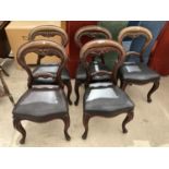 A SET OF FIVE VICTORIAN BALLOON BACK DINING CHAIRS