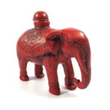 AN ORIENTAL CORAL TYPE RED ELEPHANT SNUFF BOTTLE