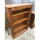 A PINE BOOKSHELF UNIT