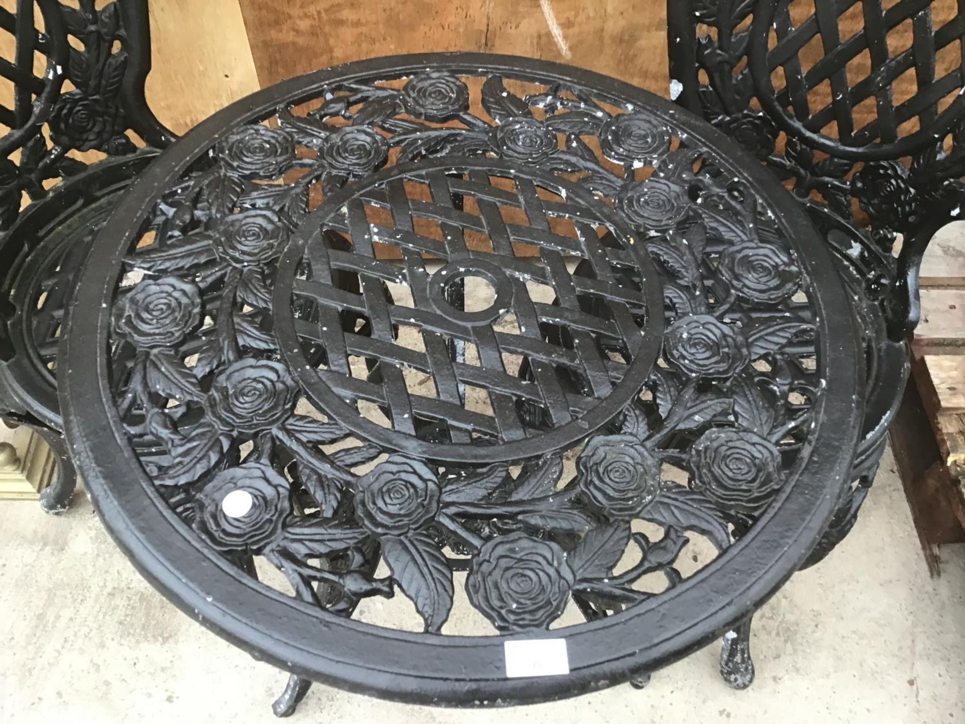 A HEAVY CAST IRON ROSE DESIGN TABLE WITH TWO MATCHING CHAIRS - Image 3 of 4