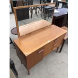 A RETRO TEAK DRESSING TABLE WITH ONE DOOR, THREE DRAWERS AND UPPER MIRROR