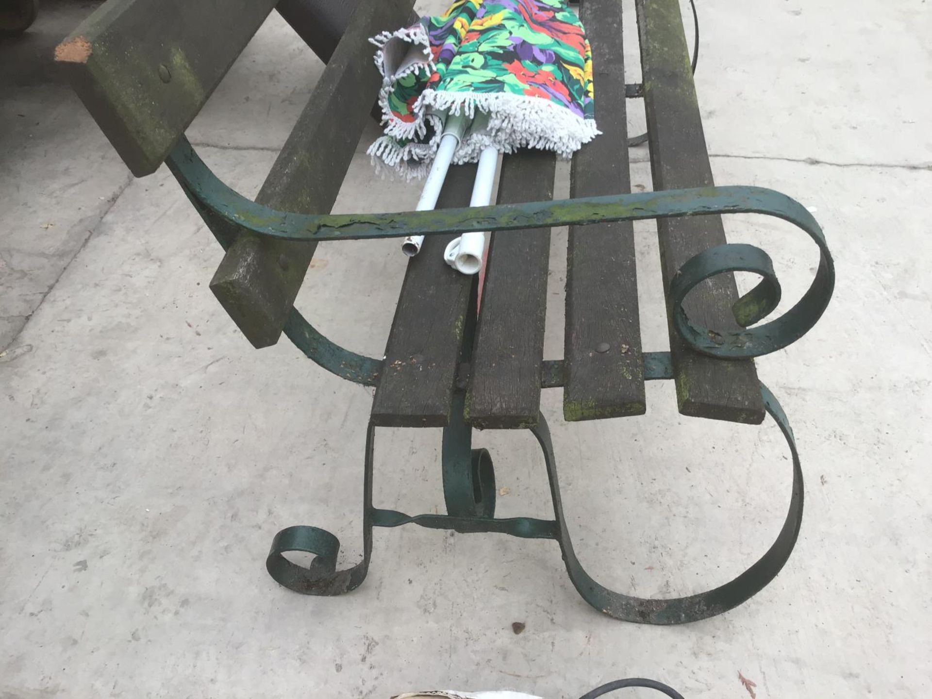 A WOODEN BENCH WITH CAST IRON ENDS AND A PARASOL - Image 2 of 3