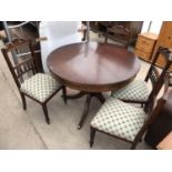 A MAHOGANY DRUM TABLE WITH FOUR MAHOGANY DINING CHAIRS