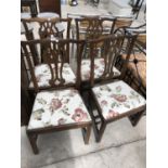 A SET OF FOUR OAK DINING CHAIRS