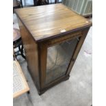 AN OAK STEREO CABINET WITH GLAZED DOOR