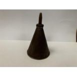 A SMALL CONICAL OIL CAN