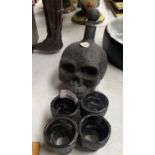 A SKULL DECANTER AND SKULL SHOT GLASSES