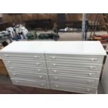 A MODERN WHITE CHEST OF TEN DRAWERS