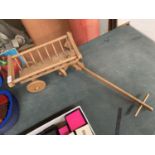 A SMALL VINTAGE WOODEN TOY CART