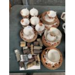 A CERAMIC TEA SET AND A COLLECTION OF WADE HOUSES