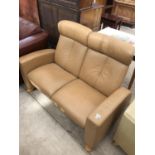 A STRESS LESS STYLE LEATHER TWO SEATER SOFA