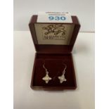 A BOXED PAIR OF SILVER STAR EARRINGS