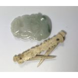 A JADE TYPE PENDANT TOGETHER WITH A BONE TOOTHPICK (2)