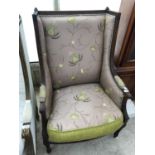 A FRENCH STYLE DECORATIVE ARMCHAIR WITH FLORAL UPHOLSTERY