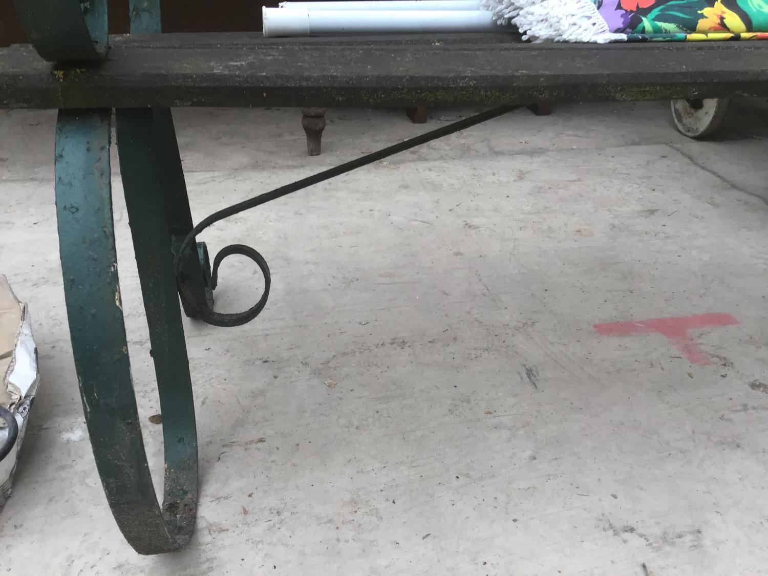 A WOODEN BENCH WITH CAST IRON ENDS AND A PARASOL - Image 3 of 3