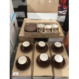 TEN SETS OF BROWN COFFEE CUPS AND SAUCERS