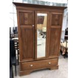 A SATINWOOD WARDROBE WITH LOWER DRAWER AND BEVEL EDGE MIRRORED DOOR