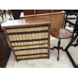 A RETRO BOOK CASE AND BOOKS AND A MAHOGANY WINE TABLE (2)