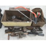 A VINTAGE WOODEN LIDDED TOOL BOX, A WOODEN BOX WITH TOOLS TO INCLUDE PLANES, SAWS, OIL CANS,