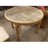 A BAMBOO AND GLASS TOPPED CONSERVATORY TABLE