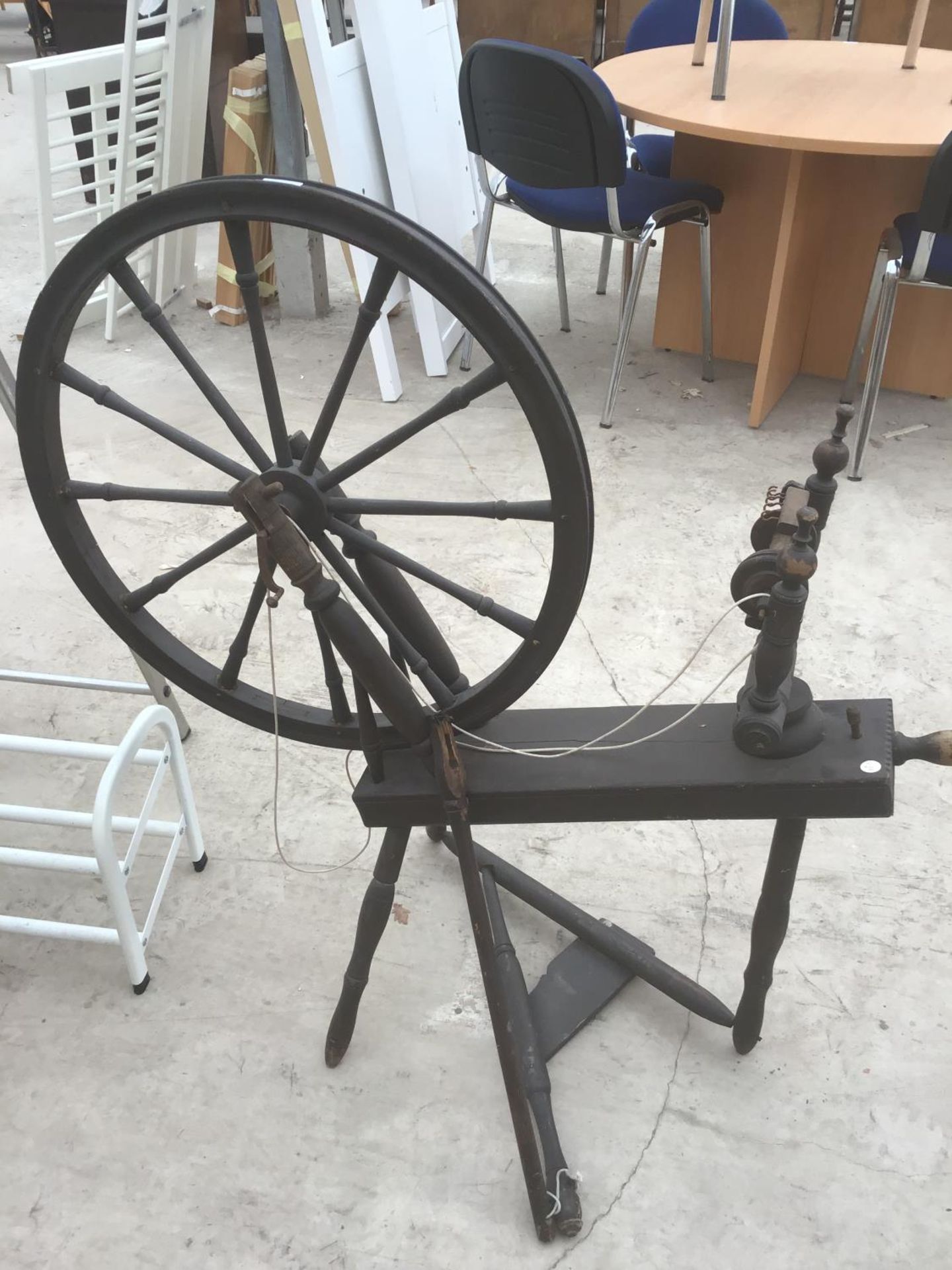 A VINTAGE SPINNING WHEEL