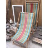TWO VINTAGE WOODEN FRAMED FOLDING DECK CHAIRS WITH STRIPED CANVAS