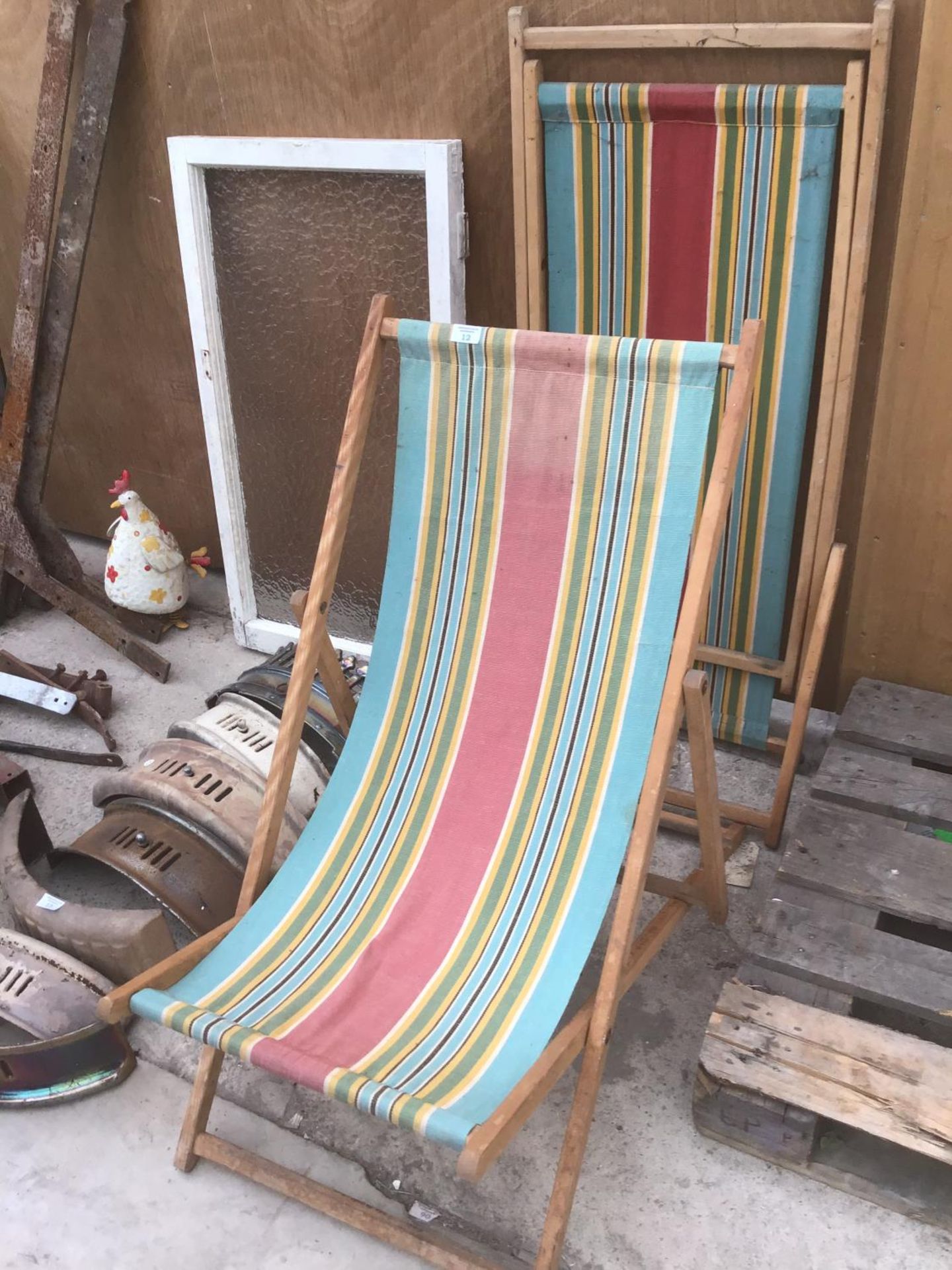 TWO VINTAGE WOODEN FRAMED FOLDING DECK CHAIRS WITH STRIPED CANVAS