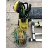A KARCHER PRESSURE WASHER AND ACCESSORIES, HOSE PIPE AND REEL IN WORKING ORDER