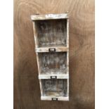 A VINTAGE STYLE THREE SECTION HANGING STORAGE UNIT