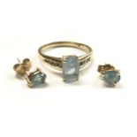 A BLUE TOPAZ JEWELLERY SUITE - COMPRISING RING AND EARRINGS, ALL SET IN 14CT YELLOW GOLD, STAMPED,