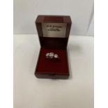 A BOXED SILVER THREE STONE RING