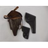 THREE LEATHER PISTOL HOLDERS