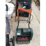 AN ELECTRIC GARDEN MOWER IN WORKING ORDER