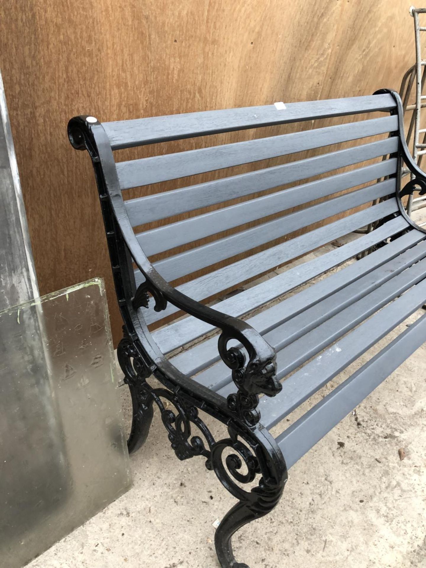 A GREY PAINTED WOODEN GARDEN BENCH WITH LION HEAD DESIGN ENDS - Image 2 of 2