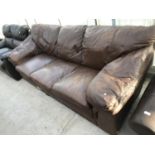 A BROWN LEATHER THREE SEATER SOFA