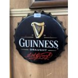 A COLLECTABLE METAL BEER BOTTLE CAP 'GUINNESS' SIGN