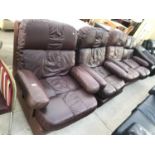 A BROWN LEATHER TWO SEATER SOFA WITH TWO MATCHING ARMCHAIRS