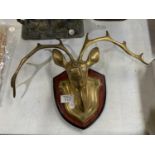 A VINTAGE BRASS MODEL OF A DEER ON WOODEN PLINTH BASE