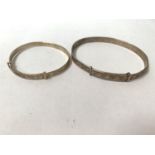 TWO SMALL SILVER BANGLES