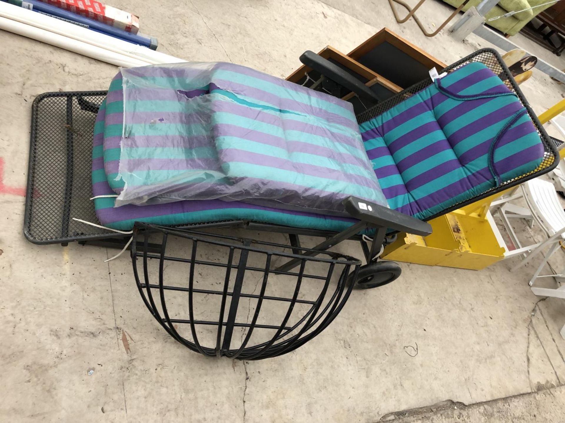 A GARDEN LOUNGER WITH CUSHIONS AND METAL HAY RACK (2)