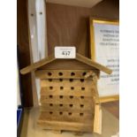 A HANDMADE WOODEN BEE NESTER